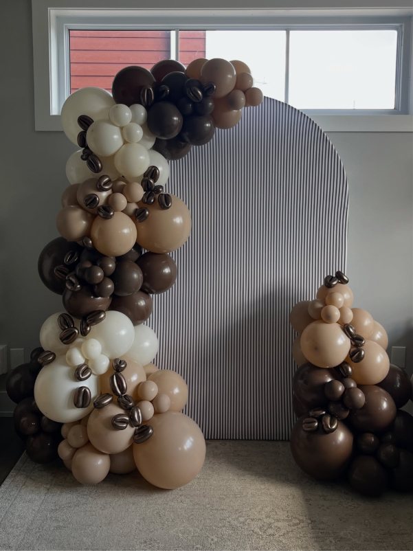 The finished espresso martini garland and striped arch