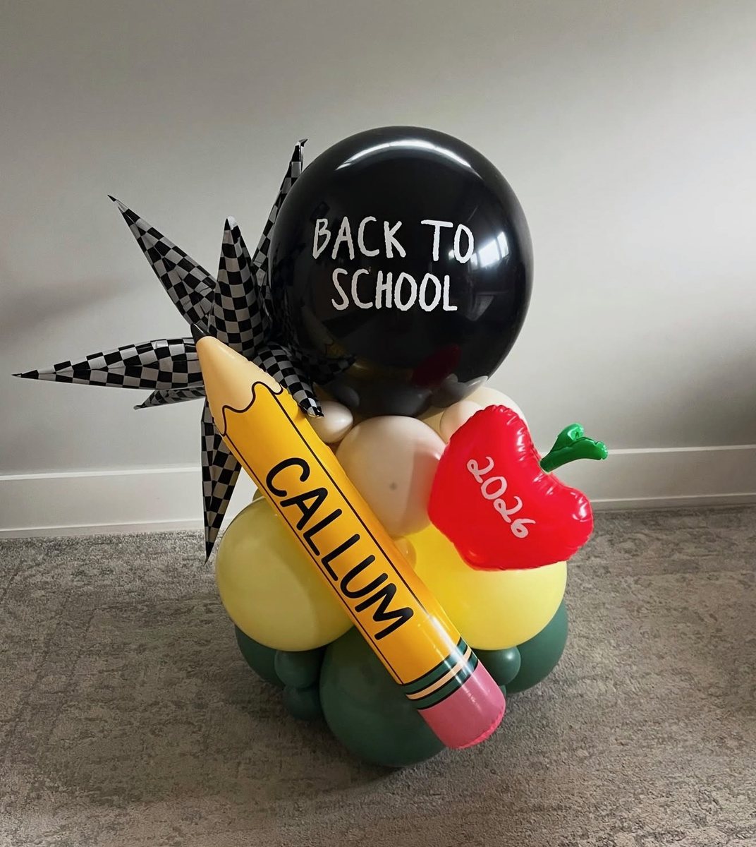 Freestanding back to school balloon piece with a personalized pencil and apple